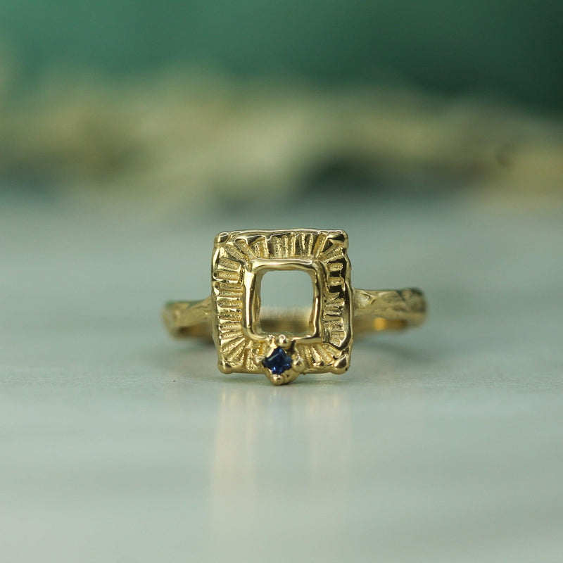 10k Yellow gold hand carved ring with a blue sapphire 