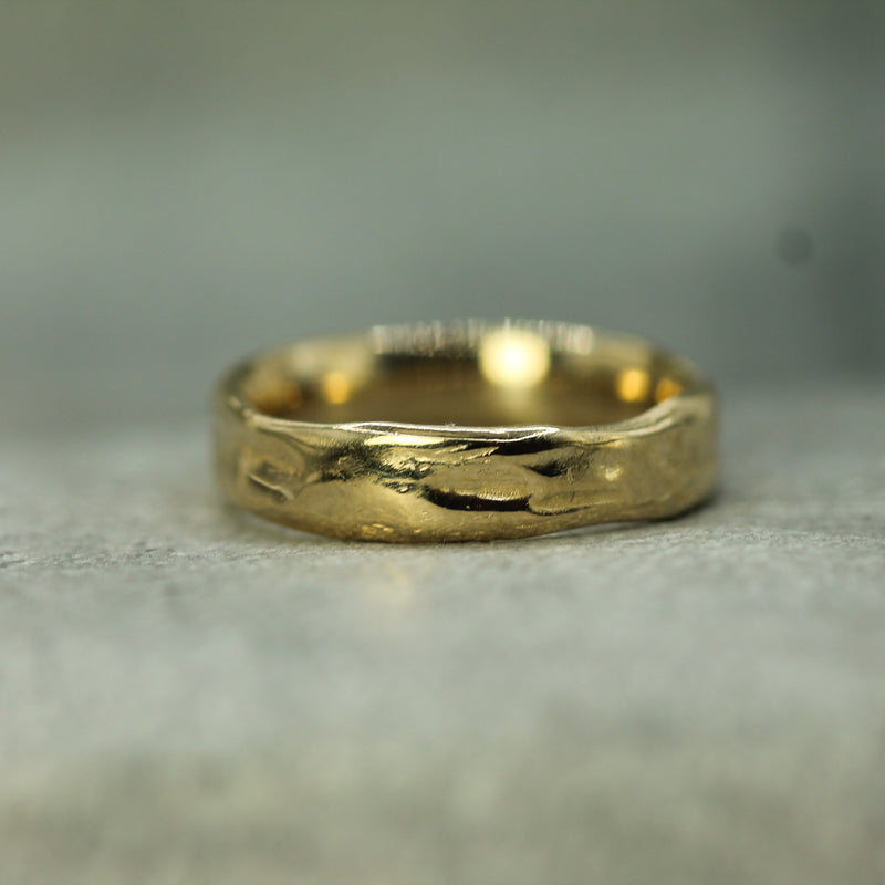 water inspired wedding band in 14k yellow gold 