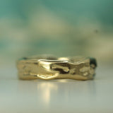 soft ocean inspired wedding band in yellow gold 