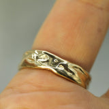 calm waters wedding band in yellow gold 