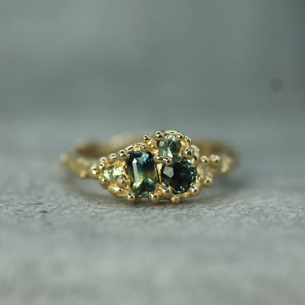 mermaid cluster ring with green and blue sapphires in 14k yellow gold 
