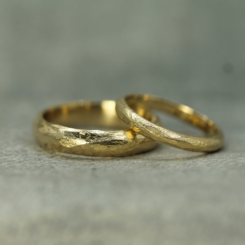 Men's and women's pebble beach bands in 14k yellow gold 