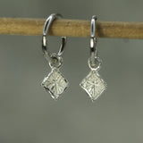 triangular shaped silver sleeper charms on click shut hoops 