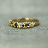 14k yellow gold band with blue sapphries 