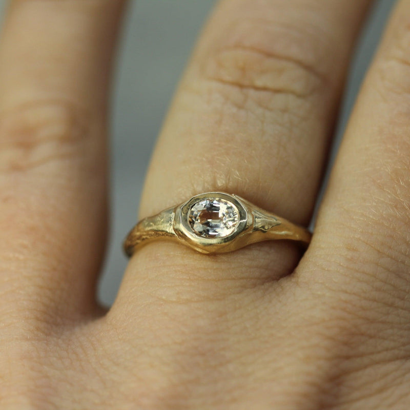 signet sapphire ring on hand 