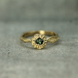 14k yellow gold green sapphire ring with leaf detail 