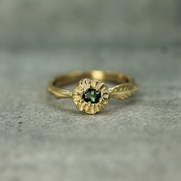 14k yellow gold green sapphire ring with leaf detail 