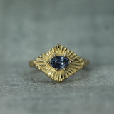 yellow gold celestial ring with blue sapphire