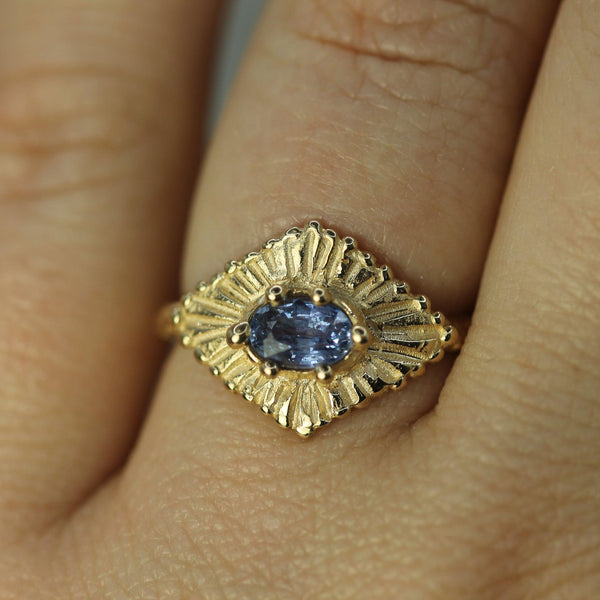 blue sapphire celestial gold ring on hand 
