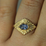 celestial yellow gold ring with blue sapphire on hand 