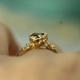 mermaid treasure green sapphire ring showing the textured details 