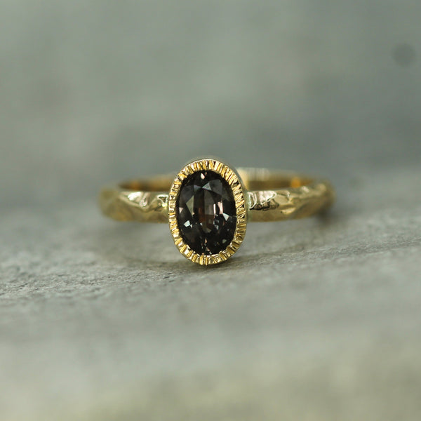 14k yellow gold bezel set purple sapphire ring 