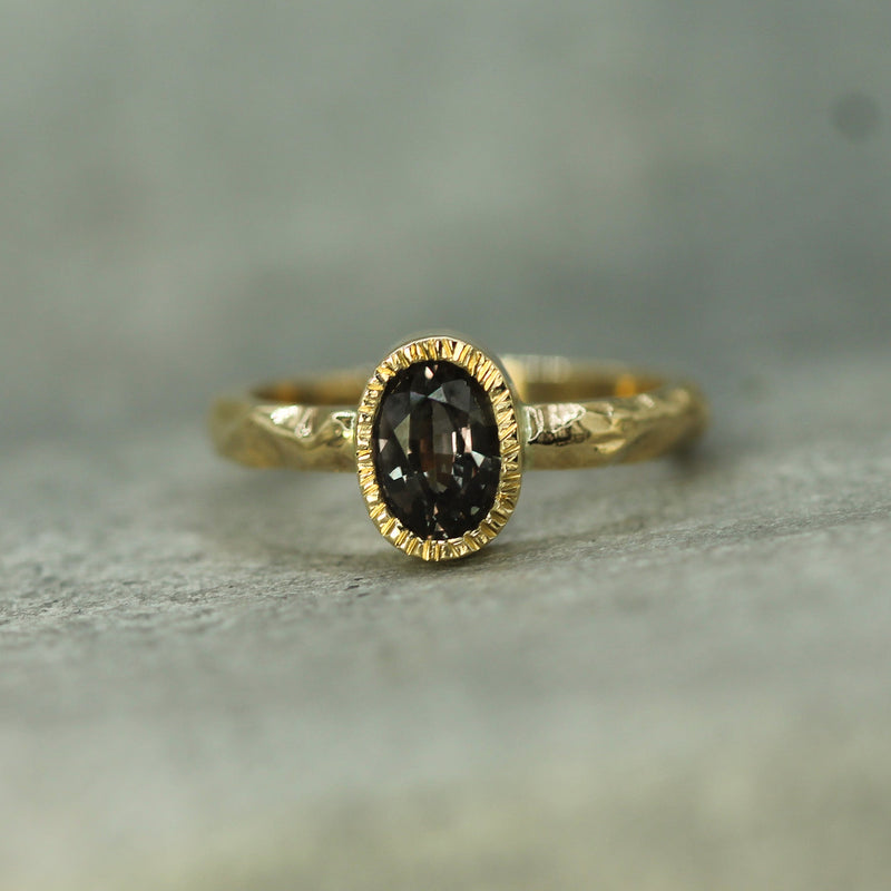 14k yellow gold bezel set purple sapphire ring 