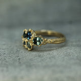 hand carved engagement ring showing the textured details of the band 
