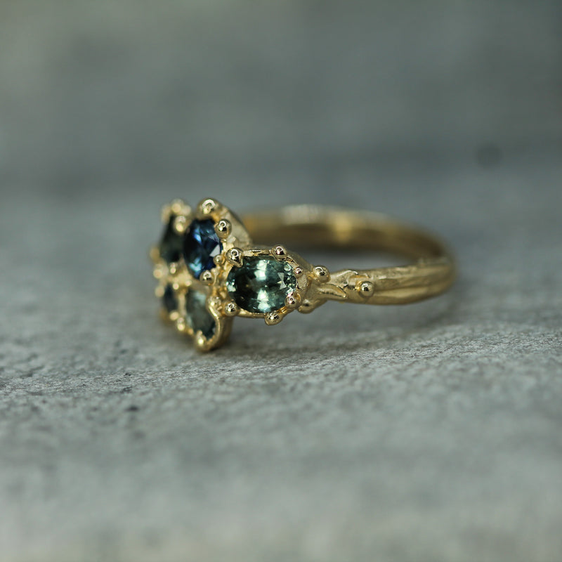 hand carved engagement ring showing the textured details of the band 
