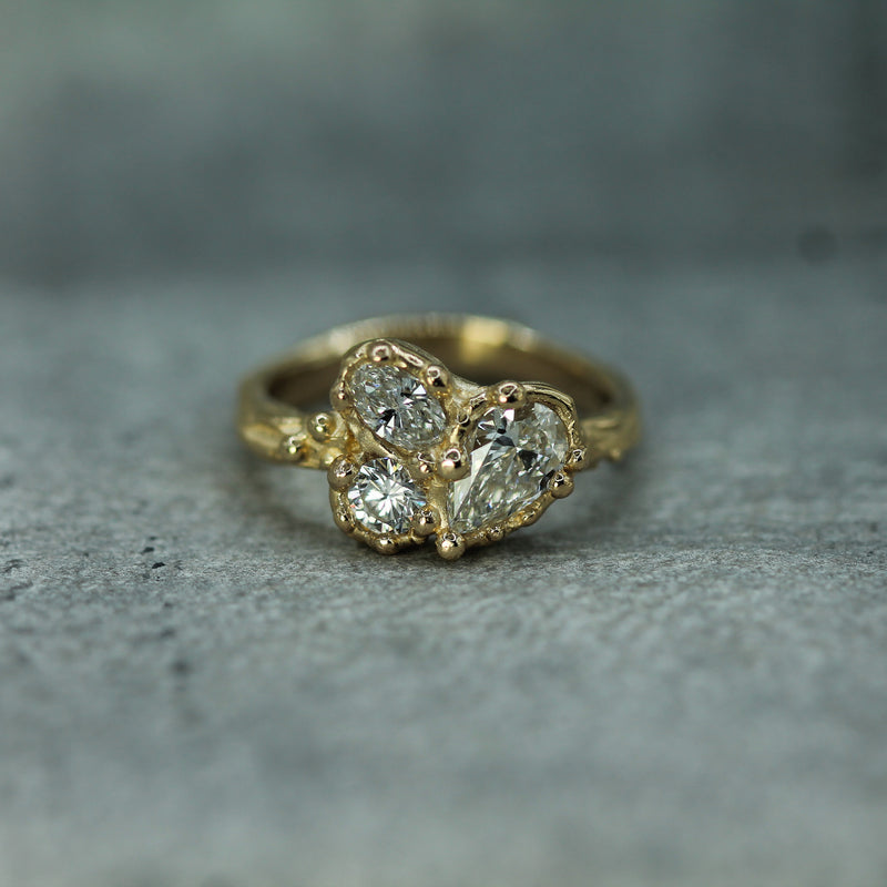 three lab-grown diamonds set in 14k yellow gold 
