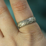 men's textured wedding band on hand 