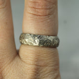 white gold wedding band on hand 