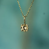 gold hand carved moon pendant 