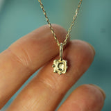 10k yellow gold crescent moon pendant on hand 