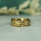 flowing gulf current textured band in 14k yellow gold 