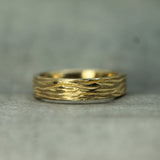 cathedral grove textured band in 14k yellow gold 
