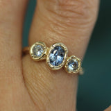 blue sapphire engagement ring on hand 