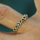 blue sapphires in a yellow gold band 