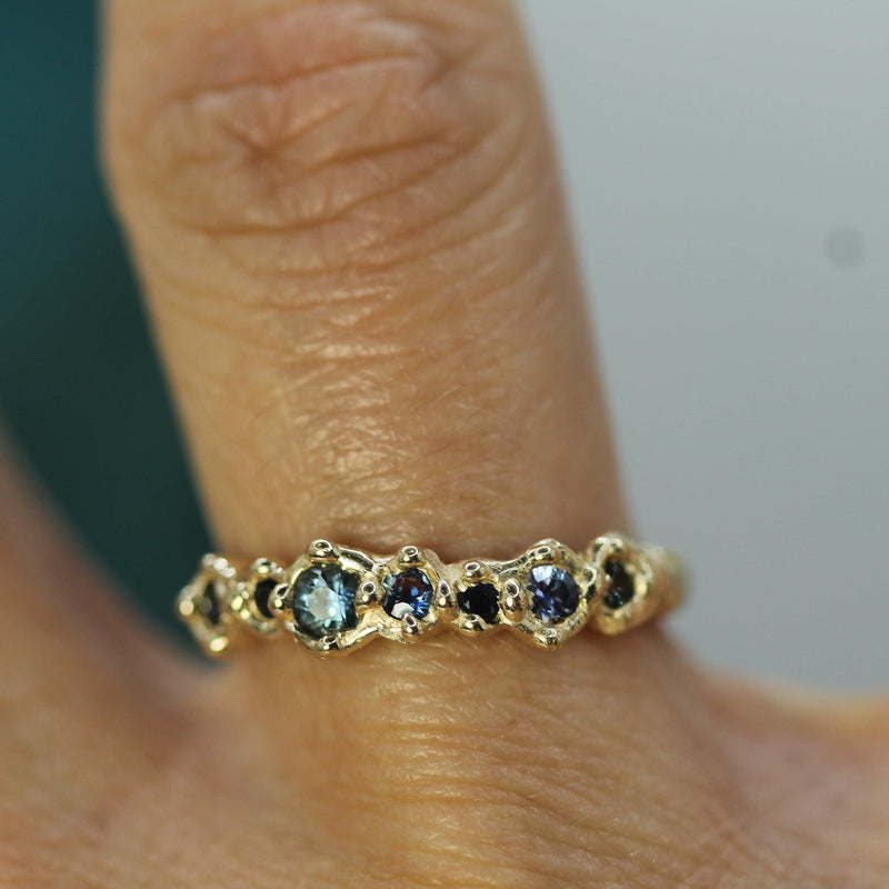 blue sapphire wedding band on hand 