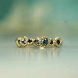 solid 14k yellow gold with varying sizes of blue sapphires 