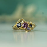 cluster of purple sapphires in an ocean inspired setting 