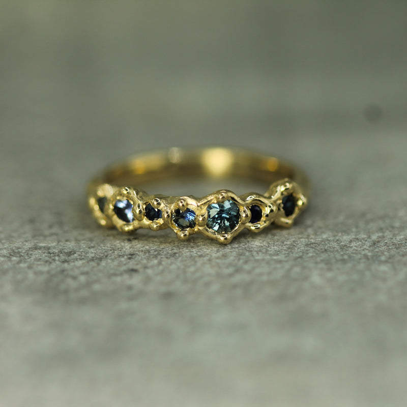 shades of blue sapphires set in yellow gold 