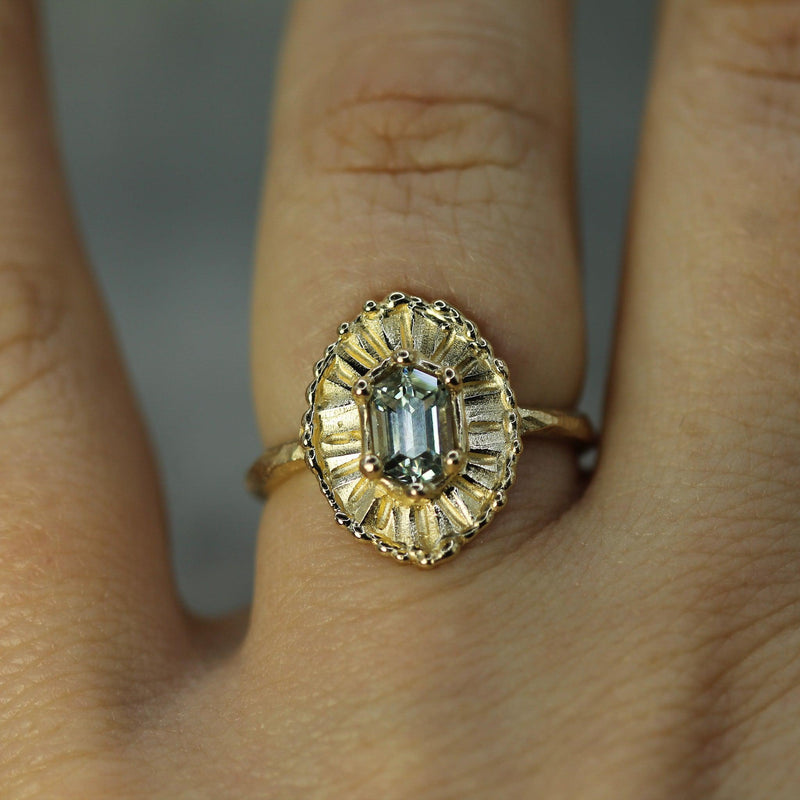 sapphire yellow gold ring on hand 