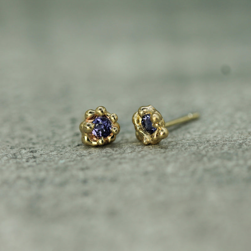 purple sapphire yellow gold studs 