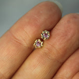 pink sapphire mermaid treasure studs on hand 