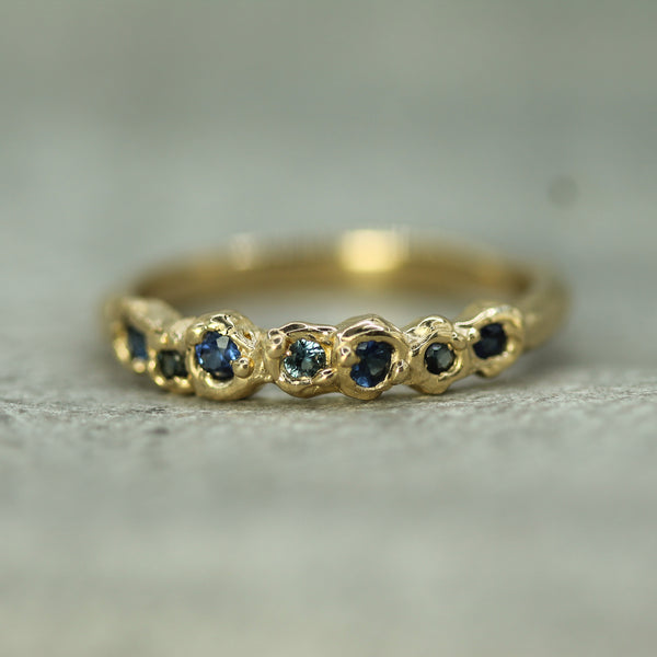 blue sapphire band in 14k yellow gold 
