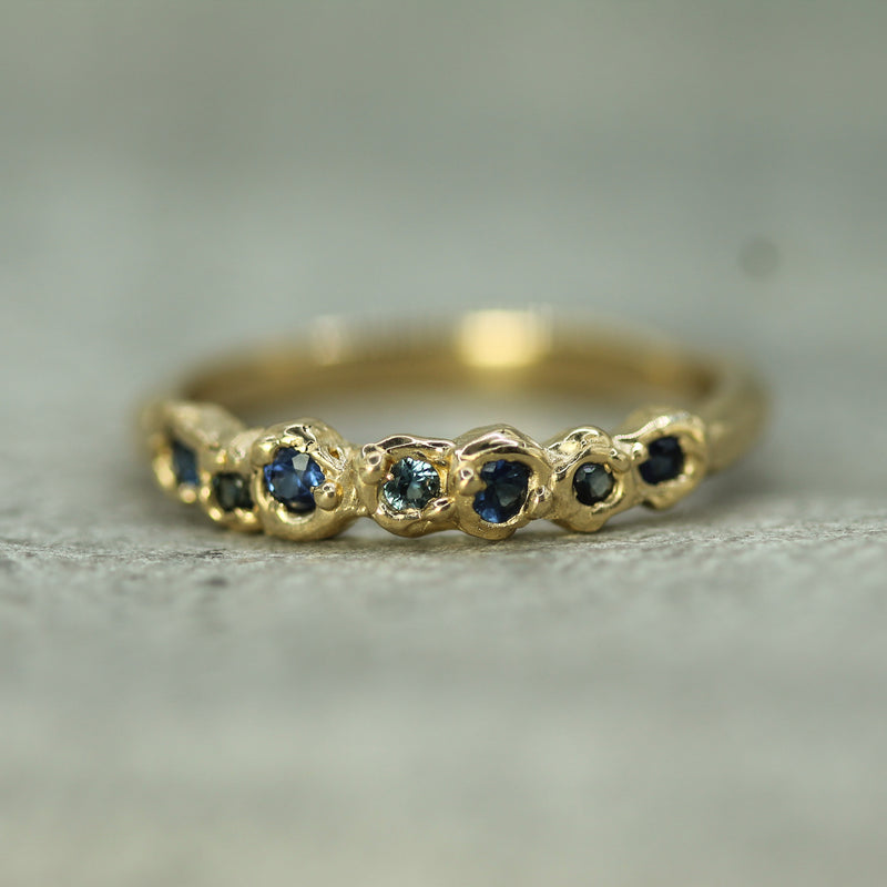 blue sapphire band in 14k yellow gold 