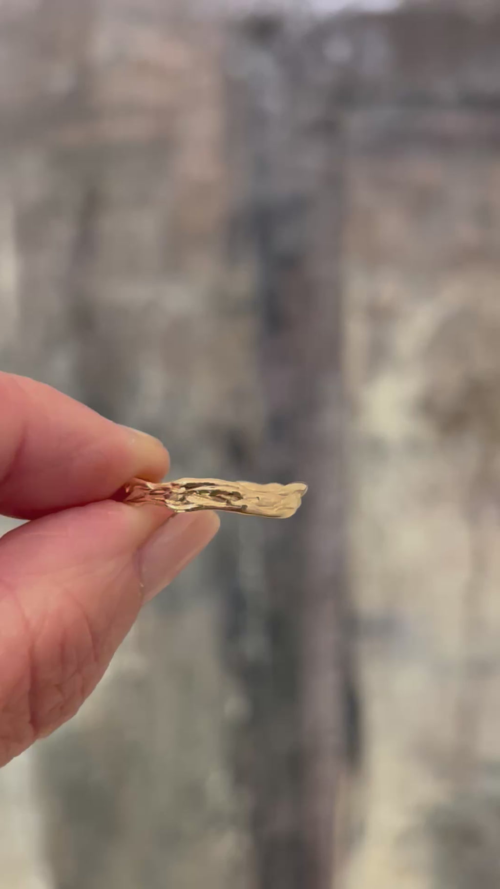 video showing the details of the hand carved goldstream band in 14k yellow gold 