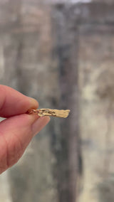 video showing the details of the hand carved goldstream band in 14k yellow gold 