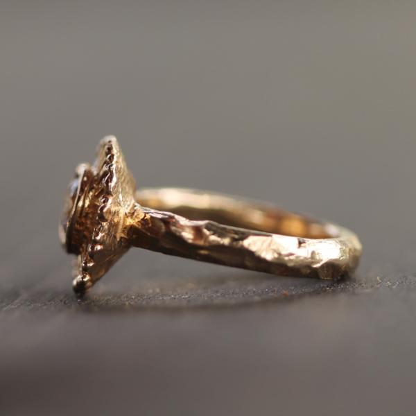Summer Sun Diamond Ring showing a handcarved band from the side profile 