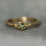 bubbly solid gold ring with green sapphire 