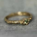 ocean inspired engagement ring with textured golden bubbles 