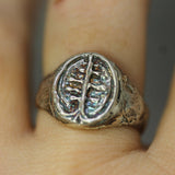 hand carved tree signet ring on hand 